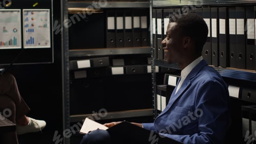 Preview: Police officers talking in evidence room