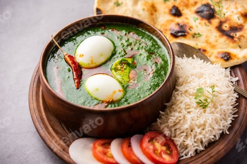 Preview: Spinach egg curry is an Indian non vegetarian dish made using palak gravy with eggs