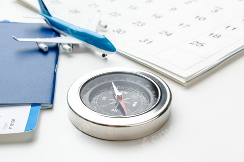 Preview: Flight tickets and compass isolated on white background close up