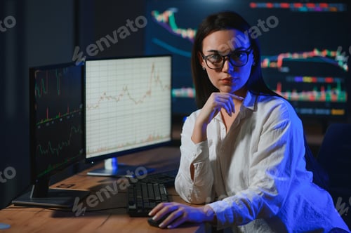 Preview: Woman trader. Lady invests through computer. Businesswoman keeps track of stock price