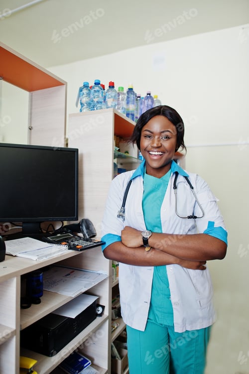 Preview: Smiling Woman Doctor Standing in Office with Stethoscope