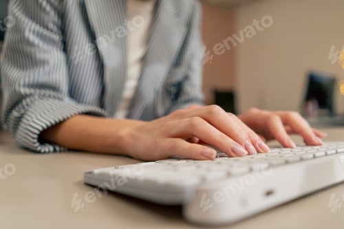 Preview: close-up of female young hands typing on white keyboard office device nude manicure professional