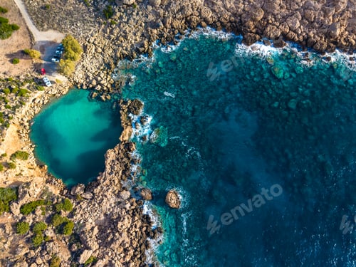 Preview: Aerial view of of a small sea crater surrounded by rocks, Voulolimni, Crete