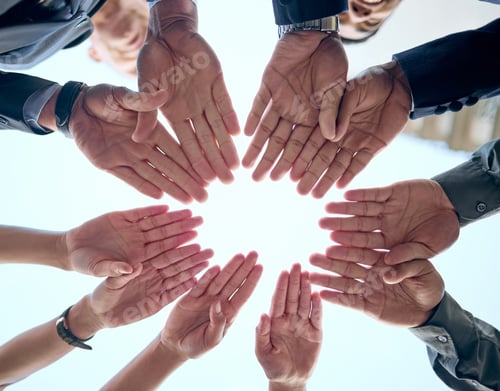 Vista previa: Shot of a group of unrecognizable businesspeople putting their hands together in a circle