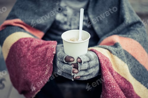 Preview: The beggars sat wrapped in cloths and eating noodles.
