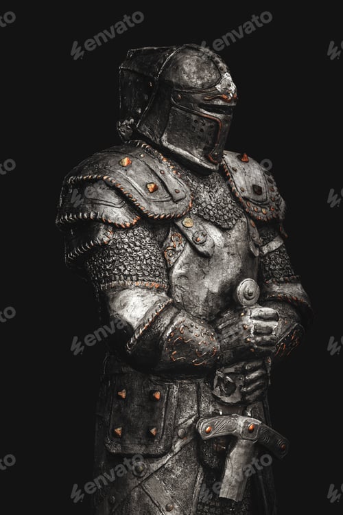 Preview: Statue of medieval knight in metal armor with a sword, isolated on dark black background