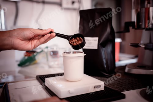 Preview: Coffee Barista hold portafilter and tamper to make special menu by coffee machine for customer in ca