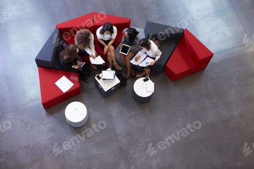 Preview: Overhead Shot Of Businesswomen Meeting In Lobby Of Office