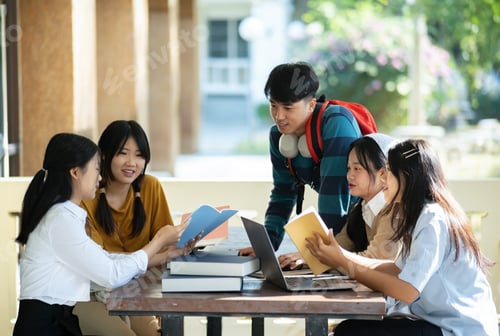 Preview: Group of students studying on campus outdoors