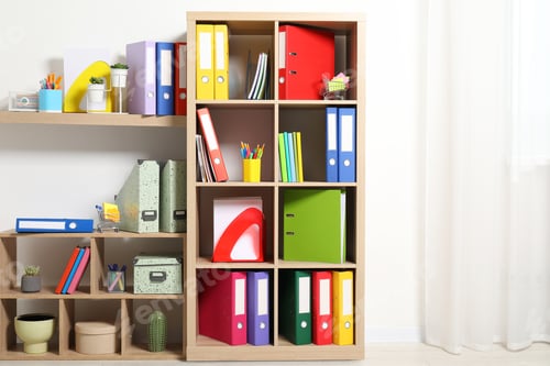 Preview: Colorful binder office folders and other stationery on shelving unit indoors