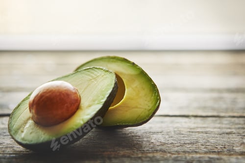 Fresh Cut Avocado on Rustic Wooden Table