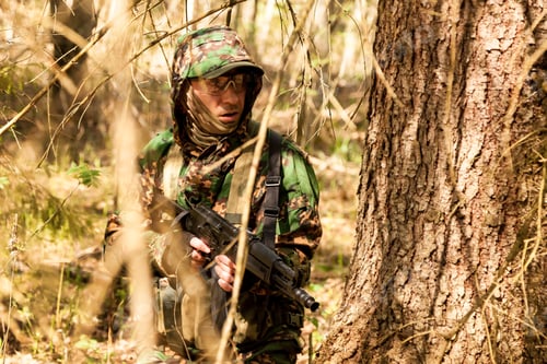 Preview: Ukrainian soldiers man dressed military camouflage uniform with weapon in woodland at nature