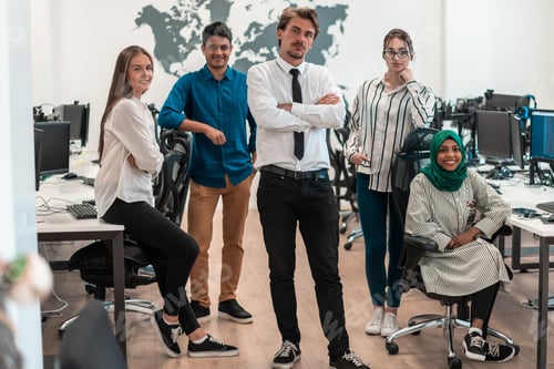 Preview: Portrait of young excited multiethnics business team of software developers standing and looking at