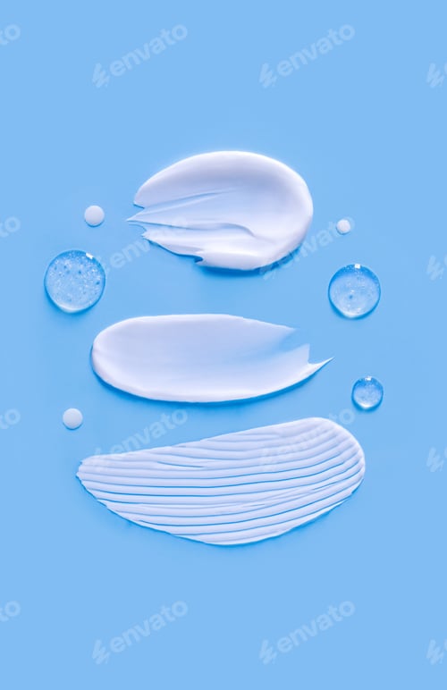 Preview: cosmetic smears cream texture on blue background