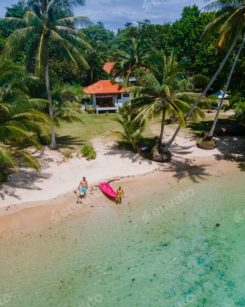 Preview: Men and women in Kayak in the ocean of the tropical Island of Koh Mak Thailand