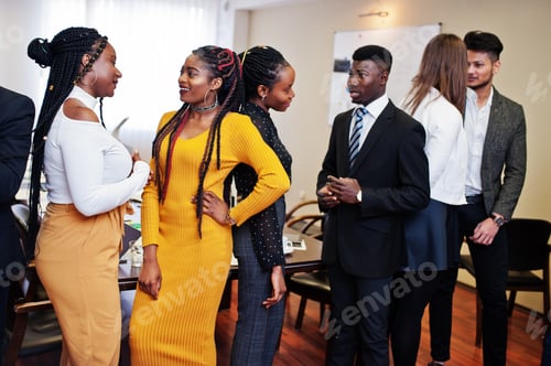 Preview: Multiracial young creative people in modern office