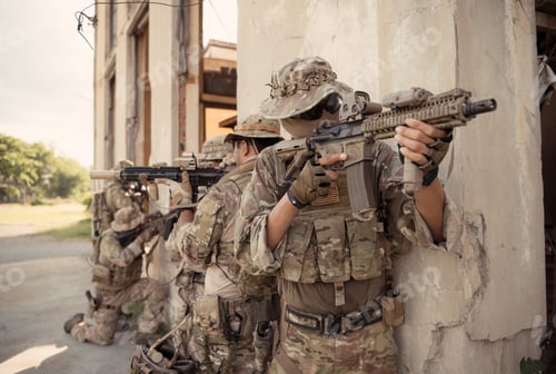 Preview: Professional marine soldiers training with weapon on a military range.
