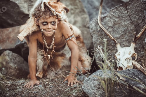 Preview: Caveman, manly boy hunting outdoors. Ancient warrior portrait.