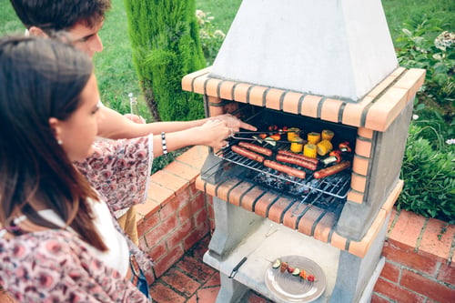 Preview: Friends cooking in barbecue on summer party
