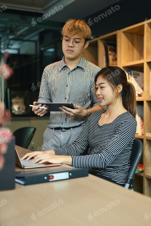 Preview: Software programmer team brainstorming, collaborating on compiling algorithm at creative office.