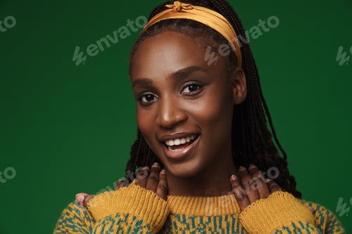 Preview: Young black woman with afro pigtails smiling and looking at camera