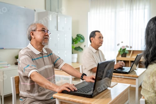 Preview: Group of Asian mature students study with instructor in class at school.