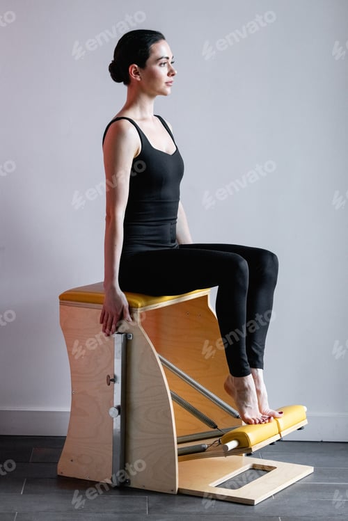 Preview: Pilates reformer chair woman fitness yoga gym exercise.