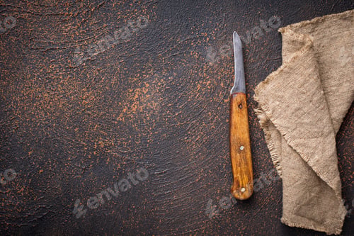 Preview: Old vintage knife on rusty background