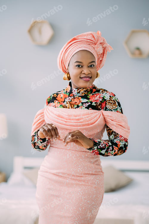 Preview: Beautiful emotional smiling woman with bright makeup against light studio background. Studio shot of