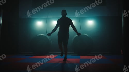 Preview: Man using a jumping rope to improve muscle strength.