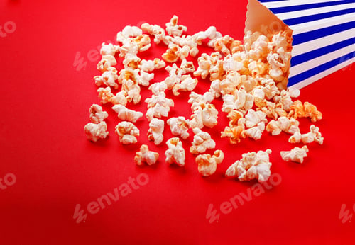 Preview: cardboard box with popcorn on a red background