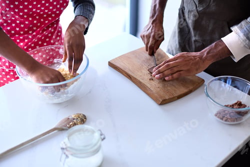 Preview: Close Up Of Couple At Home Baking Cake Together In Kitchen