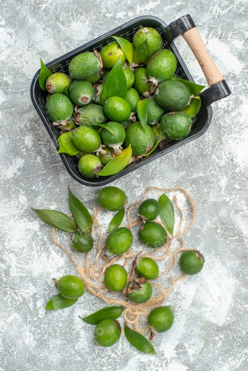 Preview: top view fresh feykhoas in basket feykhoas on grey background