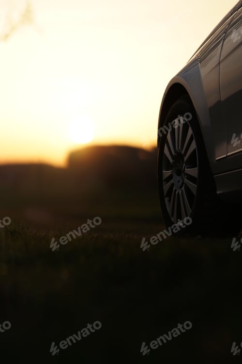 Preview: Selective of a car tyre on a sunset