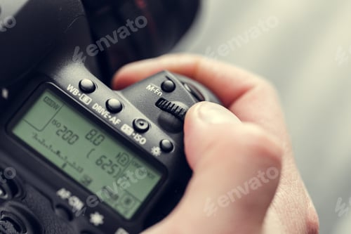 Preview: photographer with camera in hand