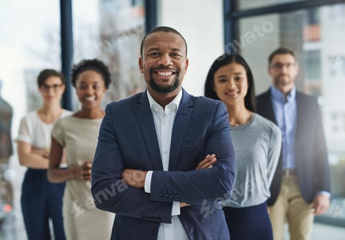 Preview: Empowered to lead an empire. Cropped shot of a group of businesspeople standing in the office.