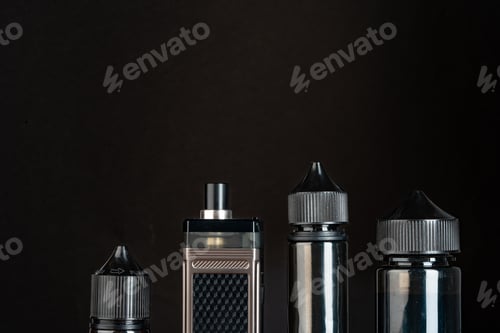 Preview: Vape and vape liquid bottles against black background