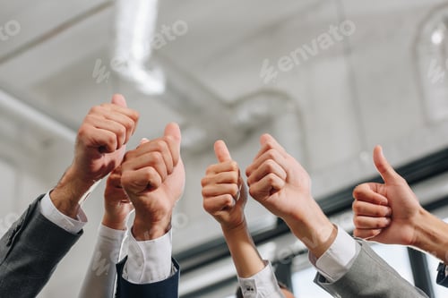 Preview: cropped image of businesspeople showing thumbs up in hub