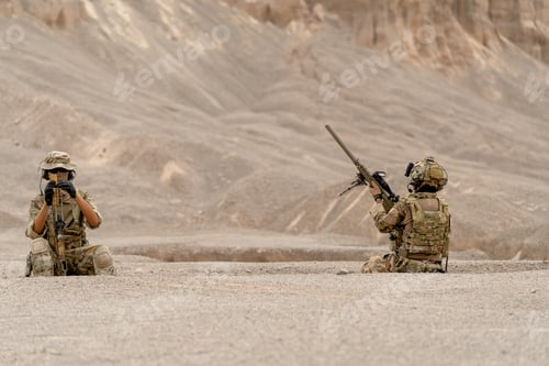Preview: Two of soilders or militaries stay in the pit and slope to relax near the mountain during outdoor