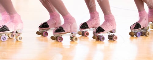Preview: Closeup of a roller skater practising in the studio with a blurry background