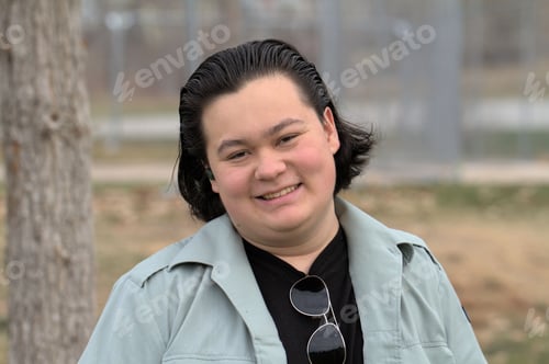 Preview: a portrait of a young Caucasian male smiling at the camera