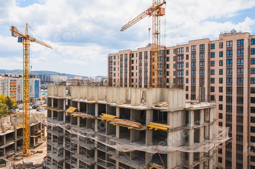Preview: Modern construction site with cranes. Incomplete building construction