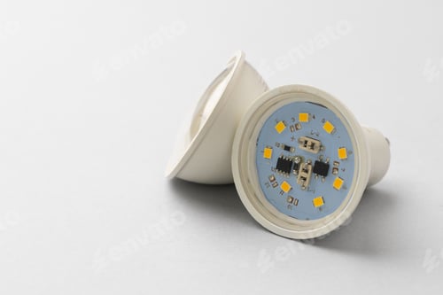Preview: Light bulb on light grey paper background