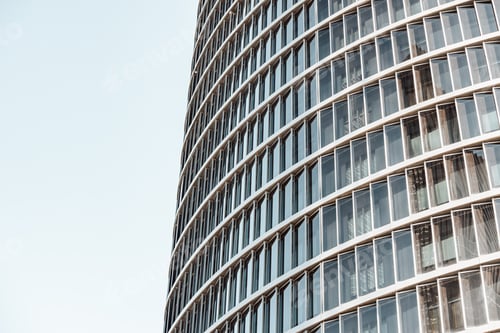 Preview: Background of a pattern of windows of a financial building with sunset reflection