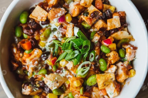 Preview: Closeup of yummy Mexican healthy food burrito bowl with chives, chicken beans and corn