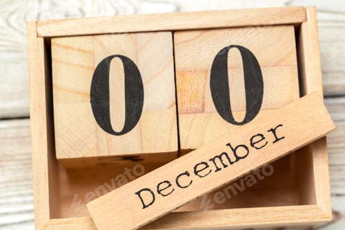 Preview: top view of parts of wooden calendar on dark wooden tabletop