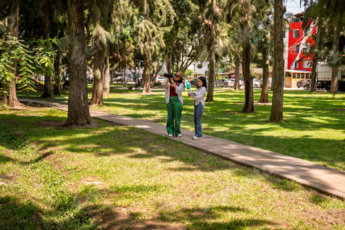Preview: Two female students doing botanical fieldwork in urban forest