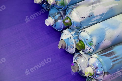 Preview: Still life with a large number of used colorful spray cans of aerosol paint