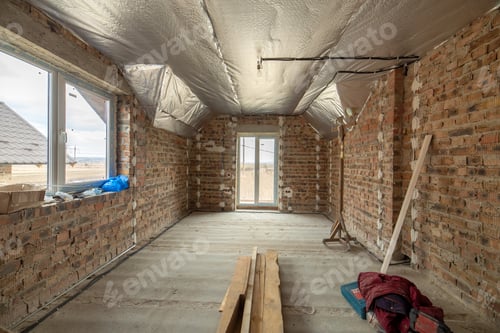 Preview: Interior of unfinished brick house with concrete floor and bare walls ready for plastering