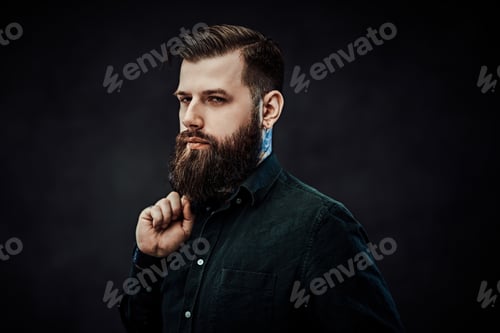 Preview: Young stylish hipster guy posing in studio